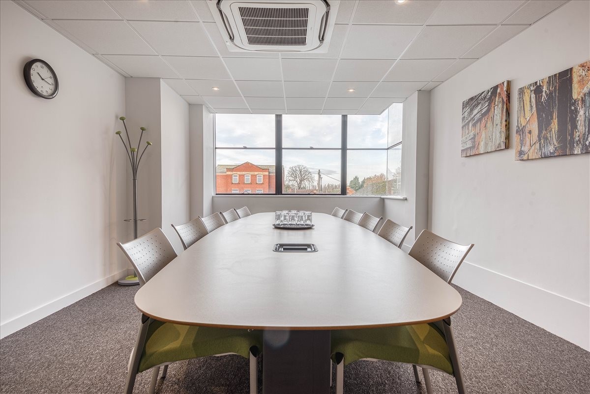 Meeting room at 31 Worcester Street, Gloucester with a large table and views of the city.