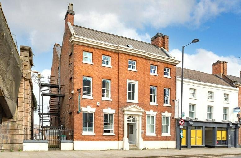 Exterior view of the historic red brick building at 32 Friar Gate, Derby.