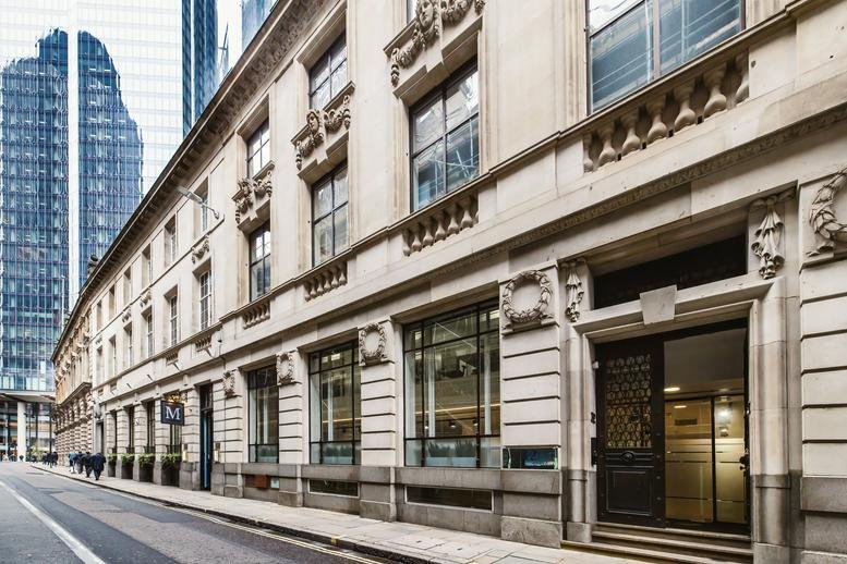 Exterior view of the historic stone facade and entrance of 32 Threadneedle Street.
