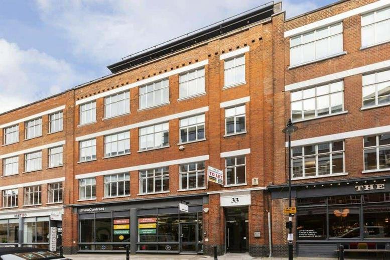 Exterior view of the traditional red brick facade at 33 Great Sutton Street.