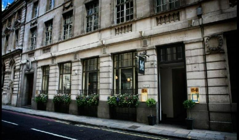 Exterior view of the historic stone facade at 34, Threadneedle Street, City of London.