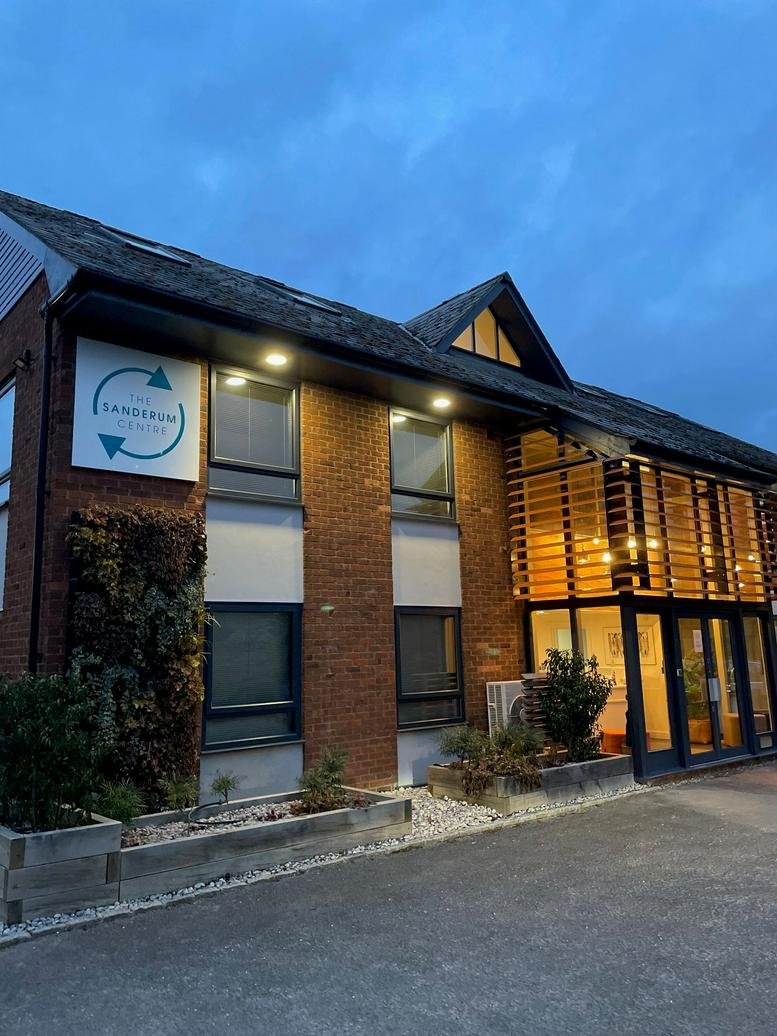 Exterior of The Lansdowne Centre building at 38 Oakley Road with brick facade and green living wall.