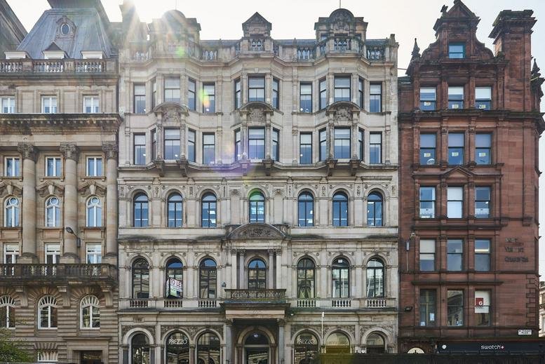 Grand historic stone facade of the 39 St Vincent Place, Glasgow building featuring ornate arched windows.