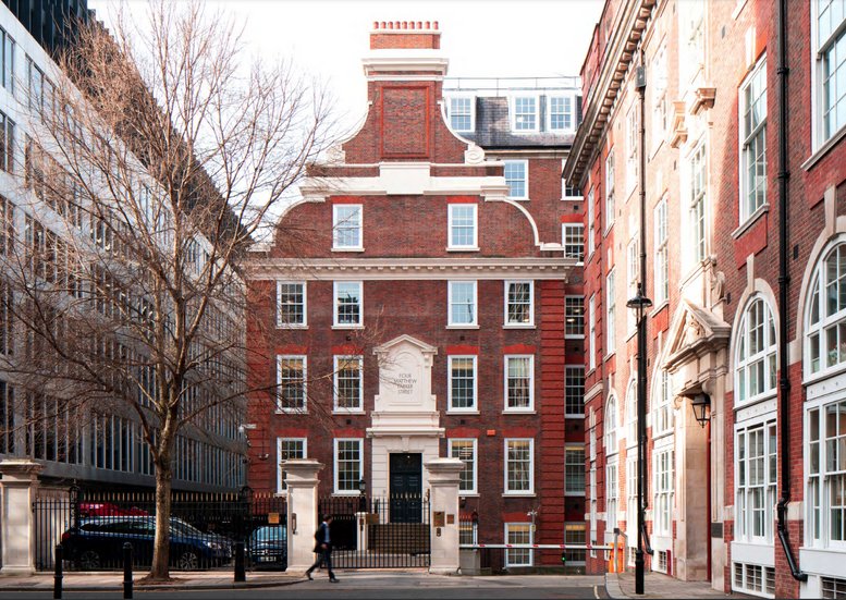Exterior of 4 Matthew Parker Street featuring red brick and a classic gabled roofline.