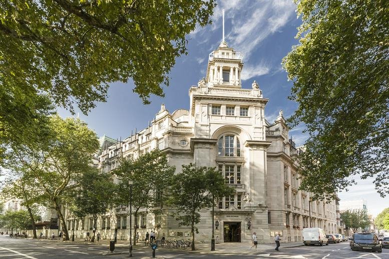 Exterior view of the historic grand stone building at 4 Millbank, London.