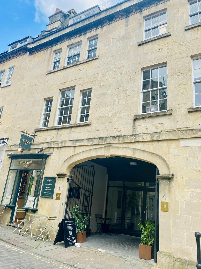 Exterior view of the historic stone facade at 4 Queen Street in Bath.