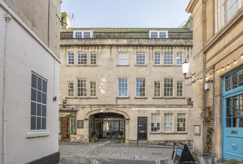 Exterior view of the historic stone facade at 4 Queen Street, Bath.