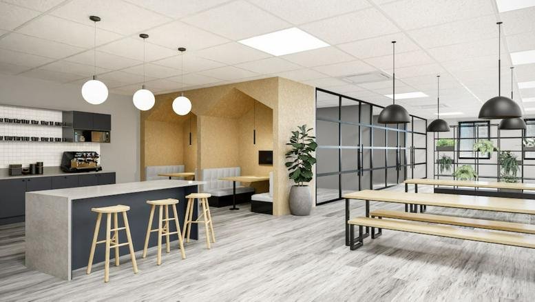 Spacious communal break area with kitchen island and seating at 40 Holborn Viaduct, London.