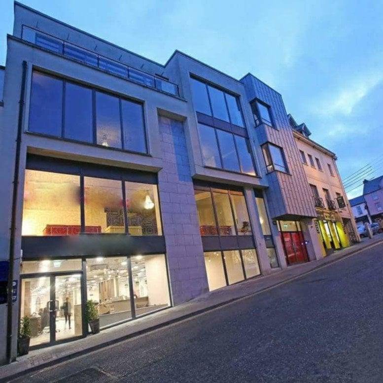 Exterior view of the modern stone and glass facade of 40 Patrick Street, Waterford.