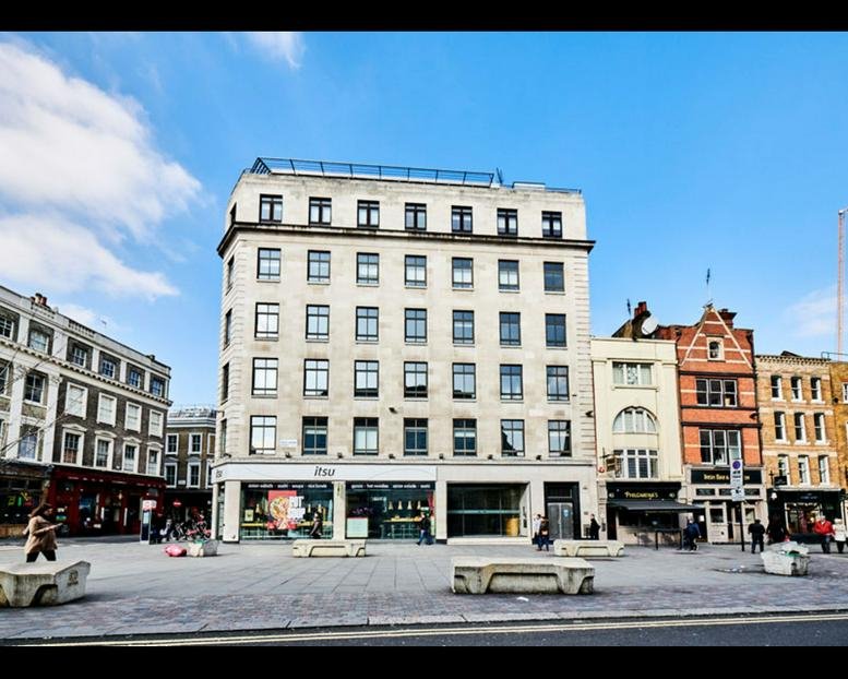 Exterior view of the historic stone and brick facade at 41-44 Great Queen Street, London.