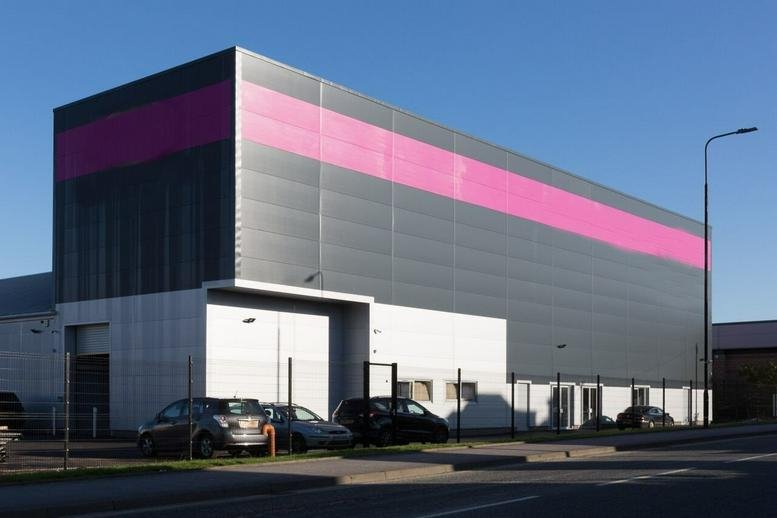 Exterior view of the grey and pink industrial facade at 41 Craven Road, Altrincham.
