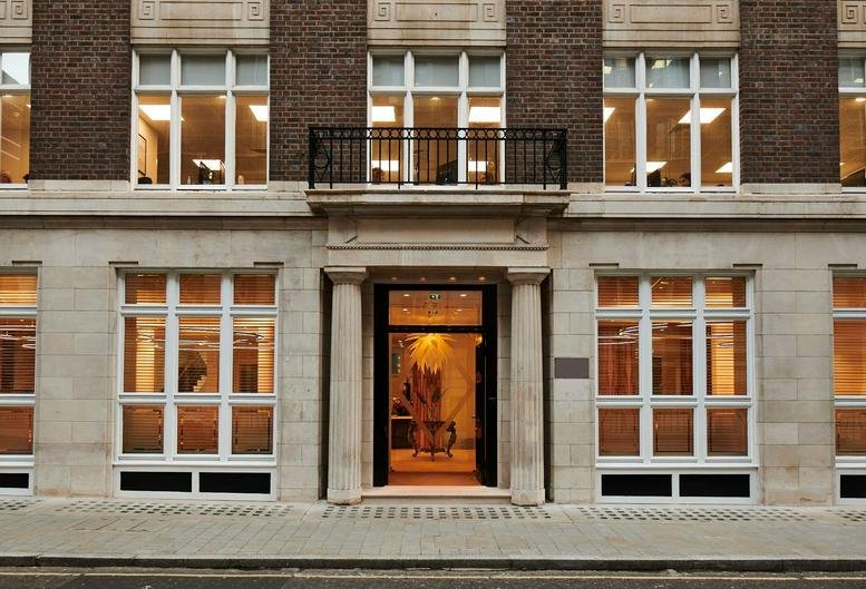 Exterior facade of 44 Southampton Buildings, WC2A showing the stone entrance and large windows.