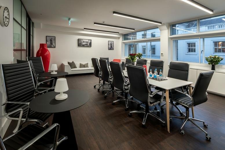 Spacious boardroom with a long table, ergonomic chairs, and large windows at 3rd Floor, 45 Albemarle Street.