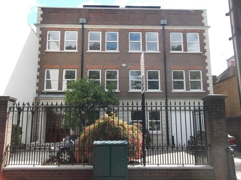 Exterior view of the brick building at 45 St Marys Road, London with front fencing.