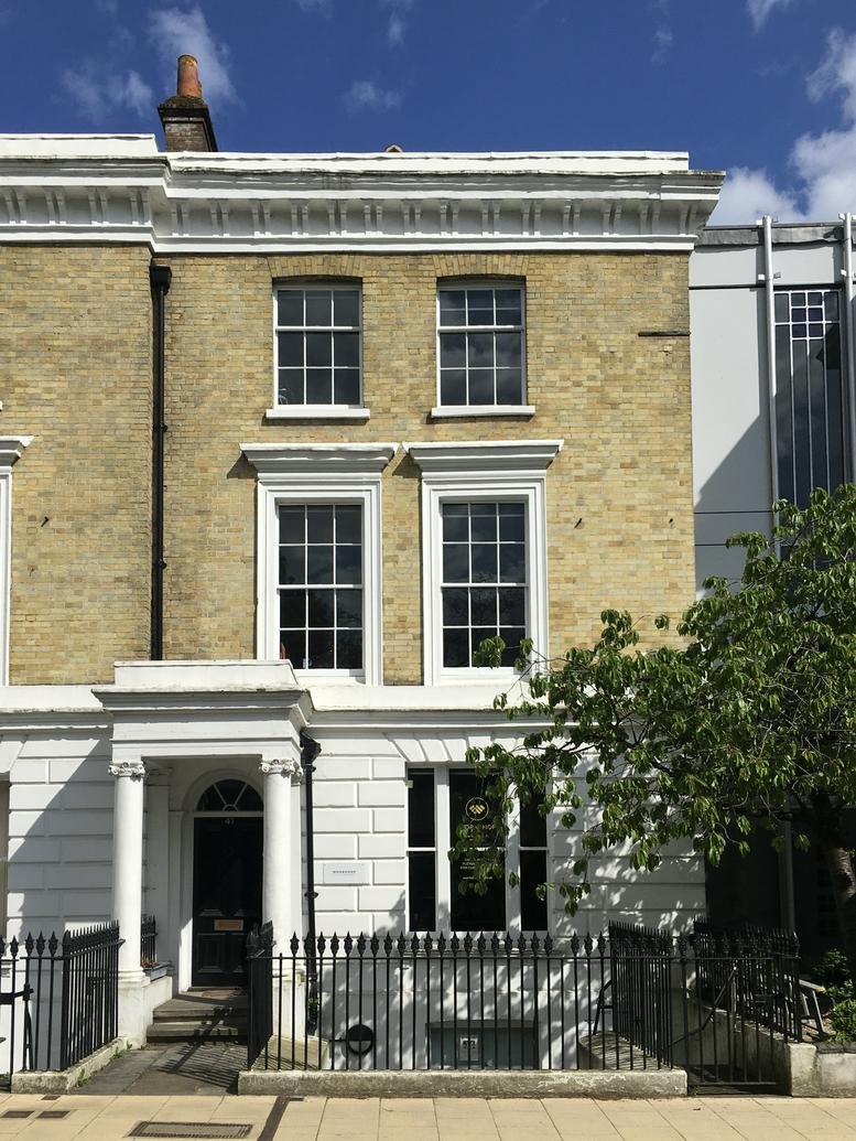 Exterior view of the classic yellow brick building at 47 Southgate Street, Winchester, Hampshire.