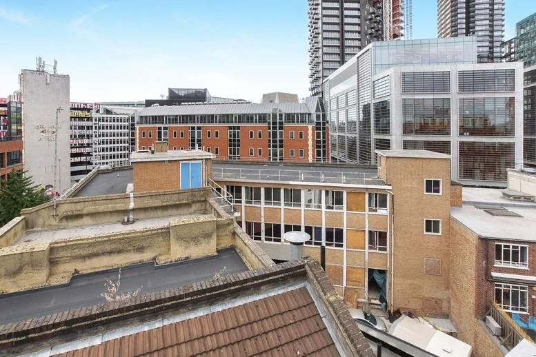 Exterior view of the mixed-architecture building at 48-50 Scrutton Street in London.