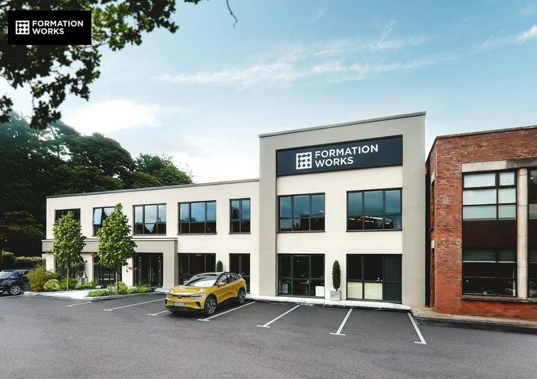 Exterior view of the modern two-story office building at 48 Newforge Lane.