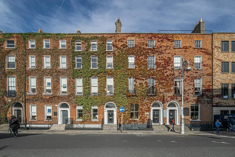 Exterior view of the brick Georgian building at 51/52 Fitzwilliam Square West, Dublin.