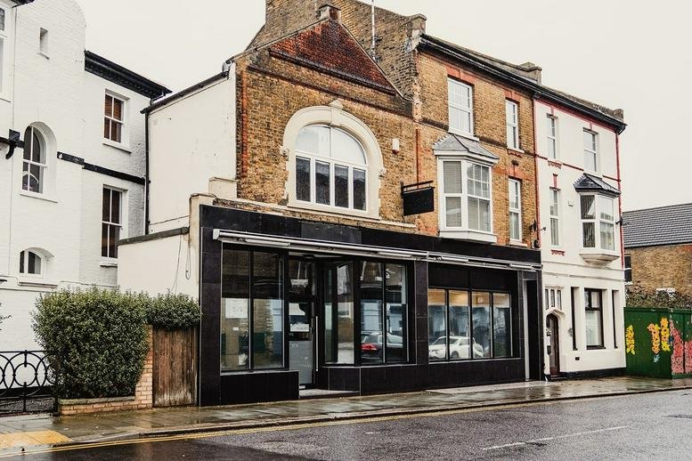 Exterior of the brick and glass fronted building at 52-54 Alexandra Street.