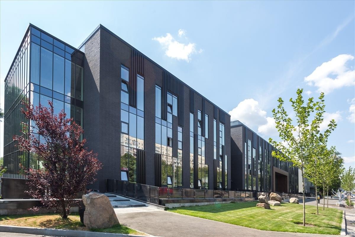 Exterior view of the modern glass and dark brick building at 53 Peremogy Avenue, Kiev, Ukraine.
