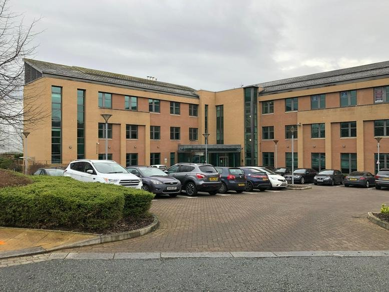 Exterior view of the brick facade at 5300 Lakeside, Cheadle Royal Business Park.