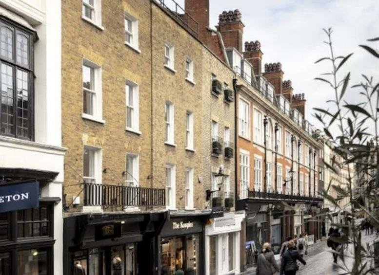 Traditional brick facade of 54 South Molton Street, Mayfair featuring large windows and street-level storefronts.