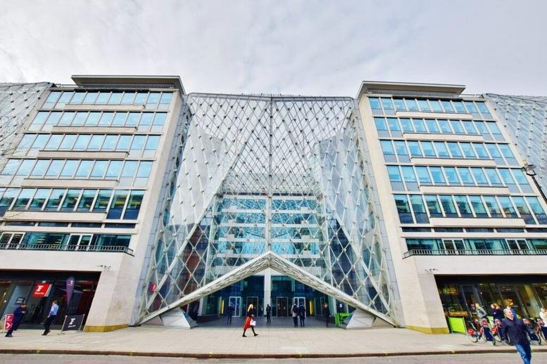 Exterior view of the modern glass and steel facade at 55 Baker Street.
