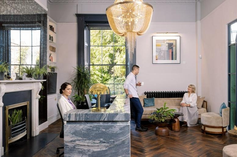 Grand reception at Viscount House, 6-7 Fitzwilliam Square, Dublin featuring a marble desk and ornate chandelier.