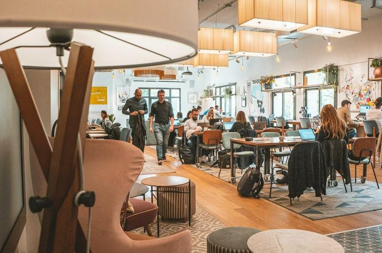 Spacious open-plan coworking area at 6, Avinguda de la Catedral, Ciutat Vella, Barcelona with warm lighting.