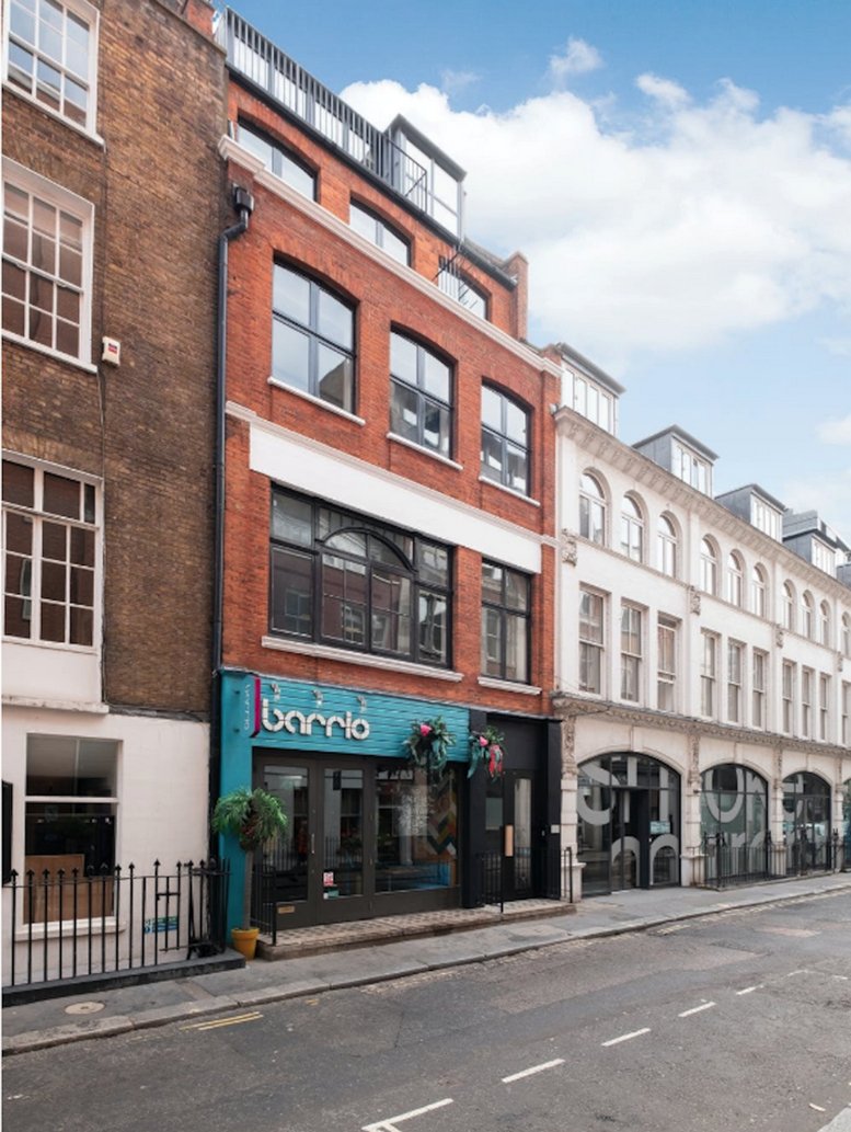 Exterior view of the brick-facade building at 6 Poland Street, London.