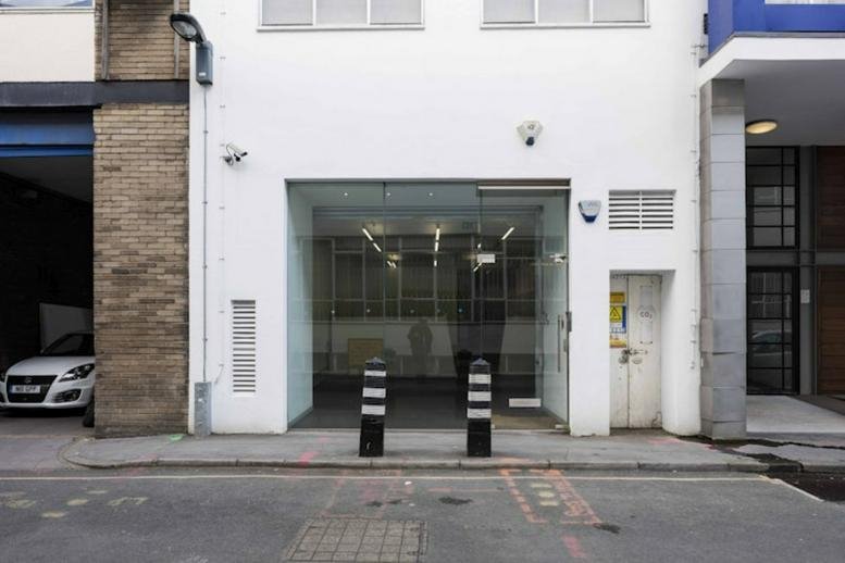 Exterior street entrance and white facade of 60, Saffron Hill, London.