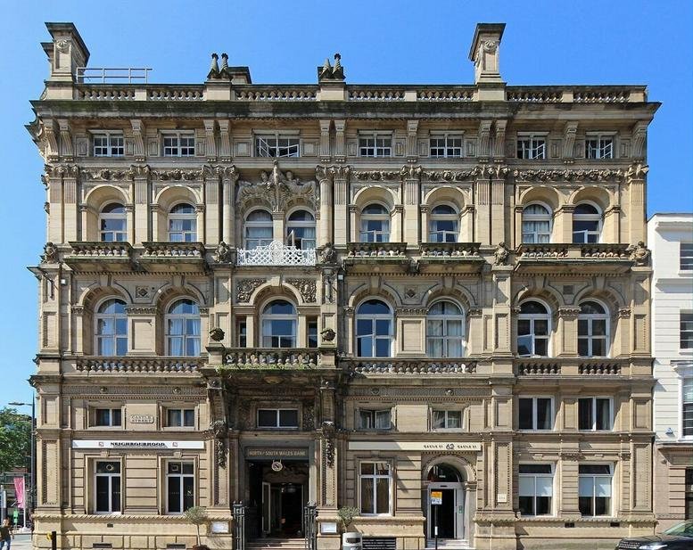 Exterior view of the ornate stone facade at 62 Castle Street, Liverpool.