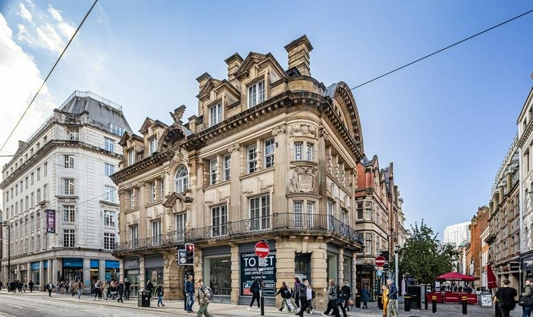 Exterior view of the ornate stone facade of Eagle Buildings at 62 Cross Street.