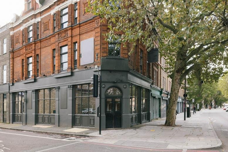 Exterior view of the traditional red brick facade at 64 Tower Bridge Road, London.
