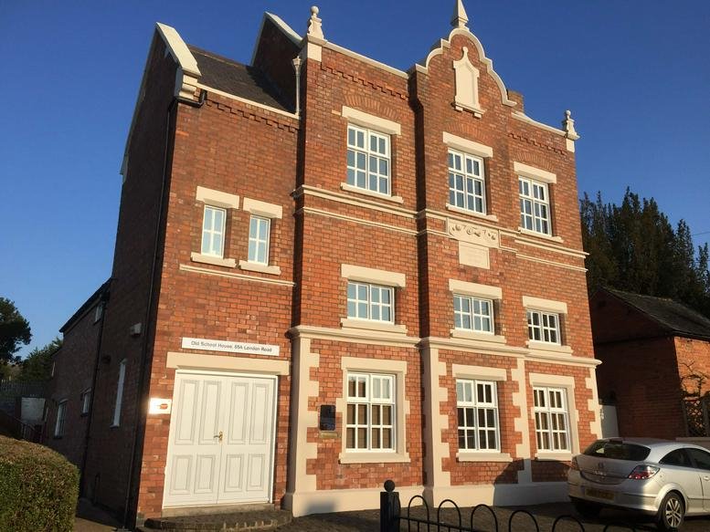 Exterior view of the brick facade building at 65A, London Road, Oadby, Leicestershire.