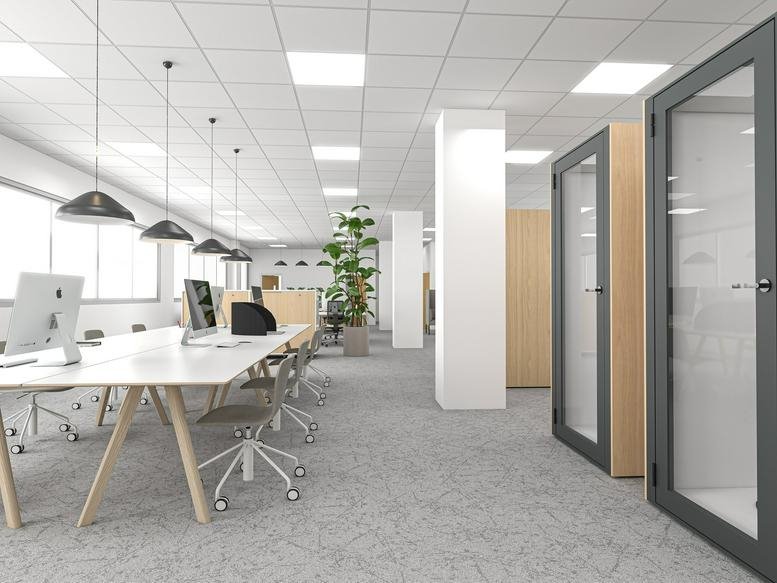 Spacious open-plan workspace at 66 High Street with sleek white desks, acoustic phone booths, and potted plants.