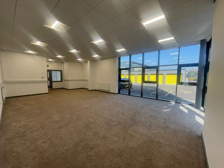 Spacious open-plan office space at 66, Pilsworth Road, Bury, Greater Manchester with natural light and carpet.