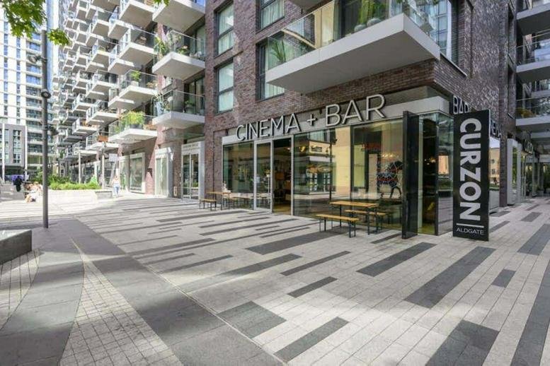 Exterior view of the modern brick facade and street-level entrance of 68 Alie Street.