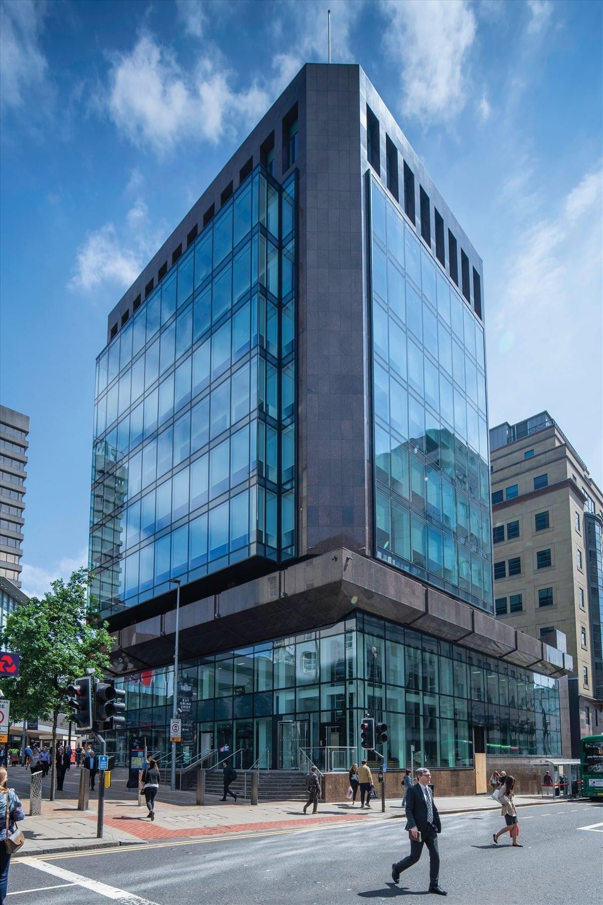 Exterior view of the contemporary glass and stone building at 7 Park Row, Leeds, LS1.