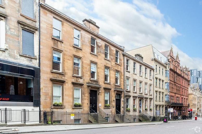 Exterior view of the traditional stone-fronted building at 70 West Regent Street, Glasgow.