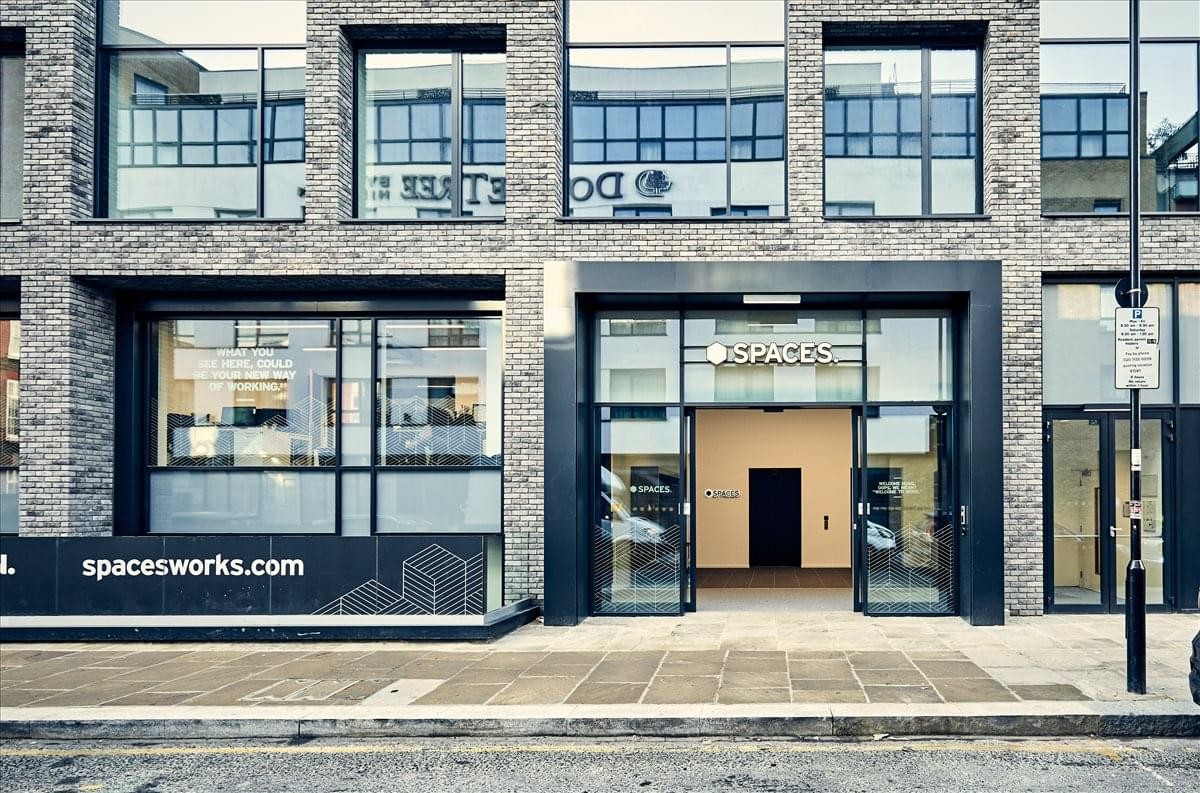 Exterior entrance of 70 White Lion Street featuring a modern brick facade and glass doors.
