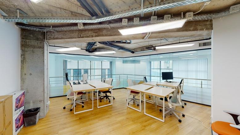 Modern open-plan office at 8, 10 Tudor Arghezi Street, Unimed buliding with sleek white desks.