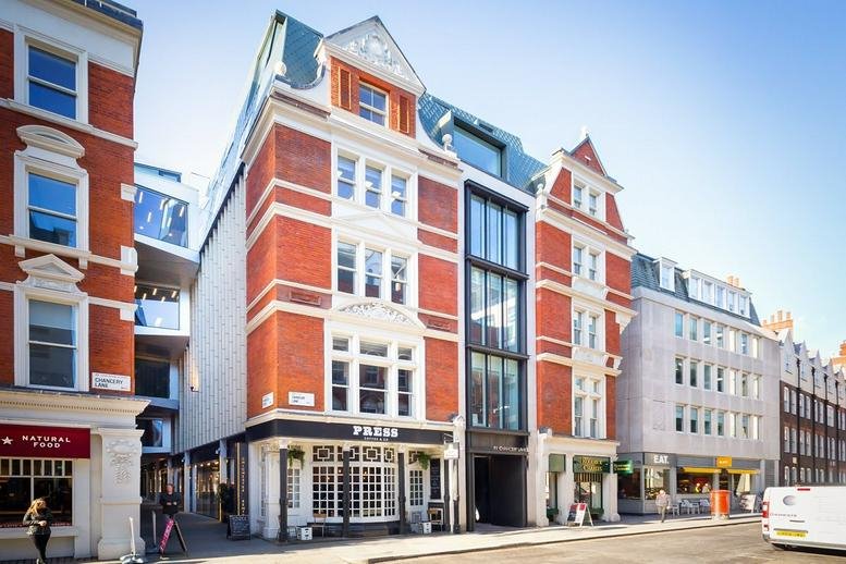 Red brick facade and entrance of 81 Chancery Lane, London, featuring traditional architecture.