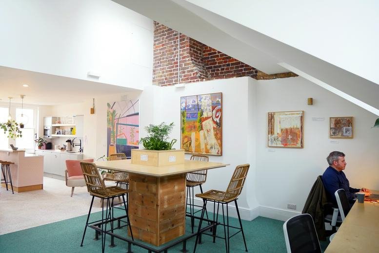 Spacious communal breakout area at 83 Queens Road, Brighton, East Sussex with high ceilings and natural light.