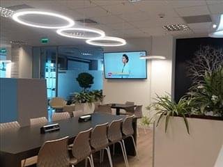Communal breakout area at 9-9A Dimitrie Pompeiu Boulevard, Iride Business Park B14 featuring halo lighting and greenery.