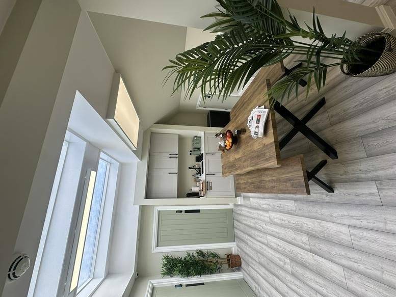 Natural wood dining table and benches at 9, Crown Passage, Kingston Upon Thames.