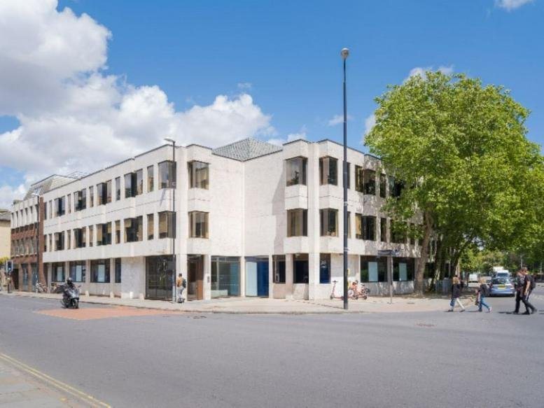 Exterior view of the contemporary white stone and glass facade at 95 Regent Street, Cambridge.