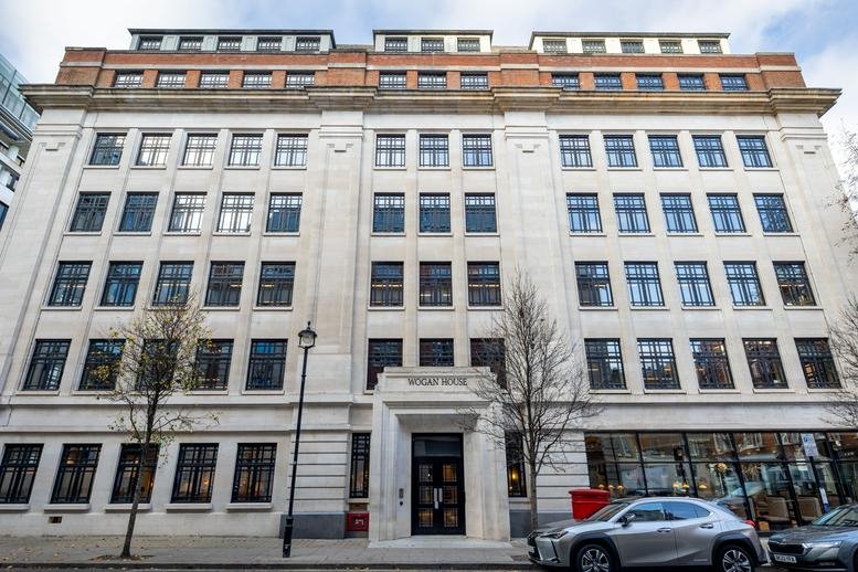 Exterior view of the grand stone facade and entrance of Wogan House.
