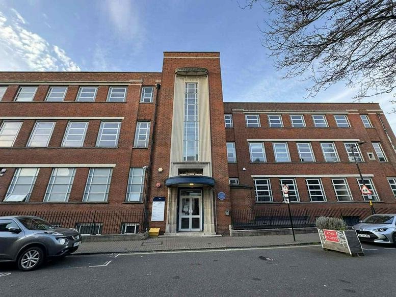 Exterior view of the brick facade and entrance at 9B, Larcom Street, London.
