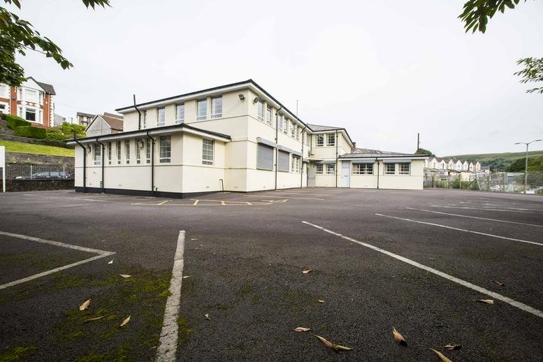 Exterior view of the office building at Aber-Rhondda Road, Porth with a large private parking area.